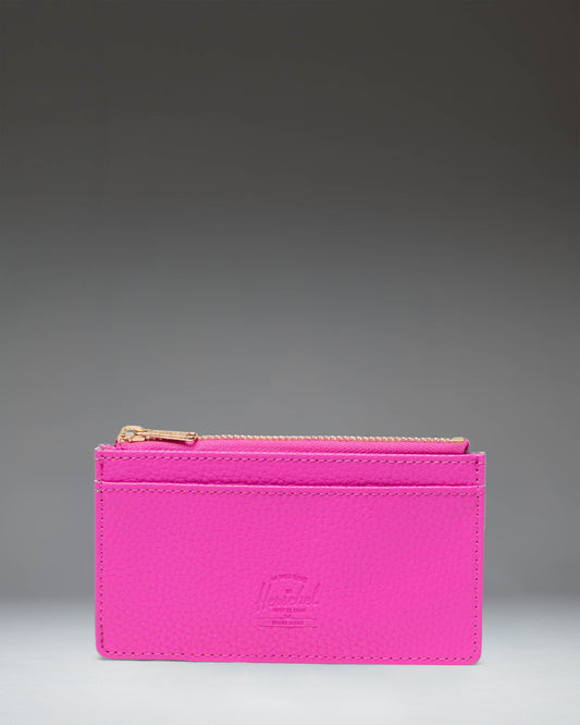 Herschel Supply Co. Oscar Large Cardholder in Rose Violet vegan leather, showing the front slots and classic woven label.