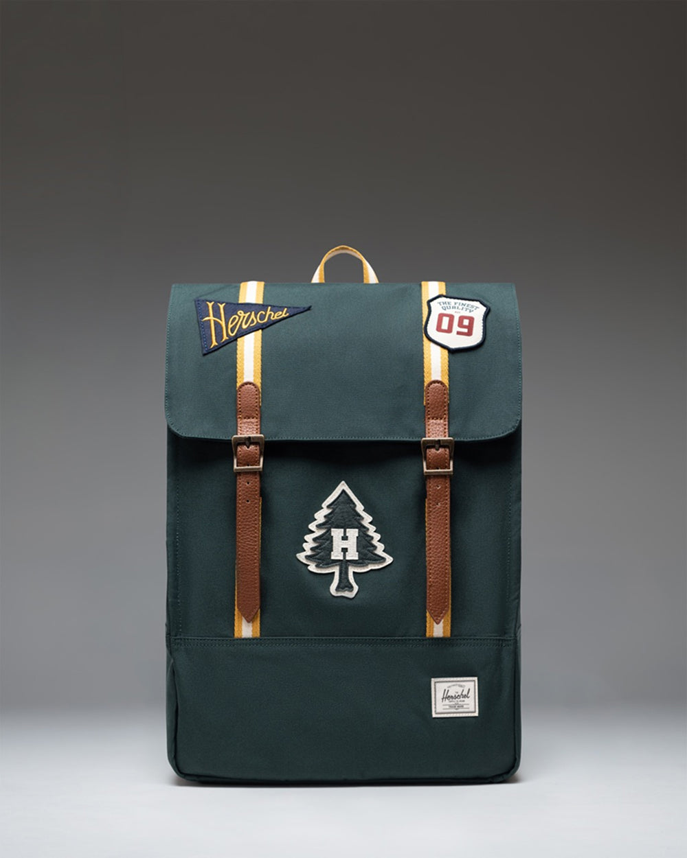 Herschel Supply Co. Survey backpack in the Patches Green Gables green camouflage pattern.