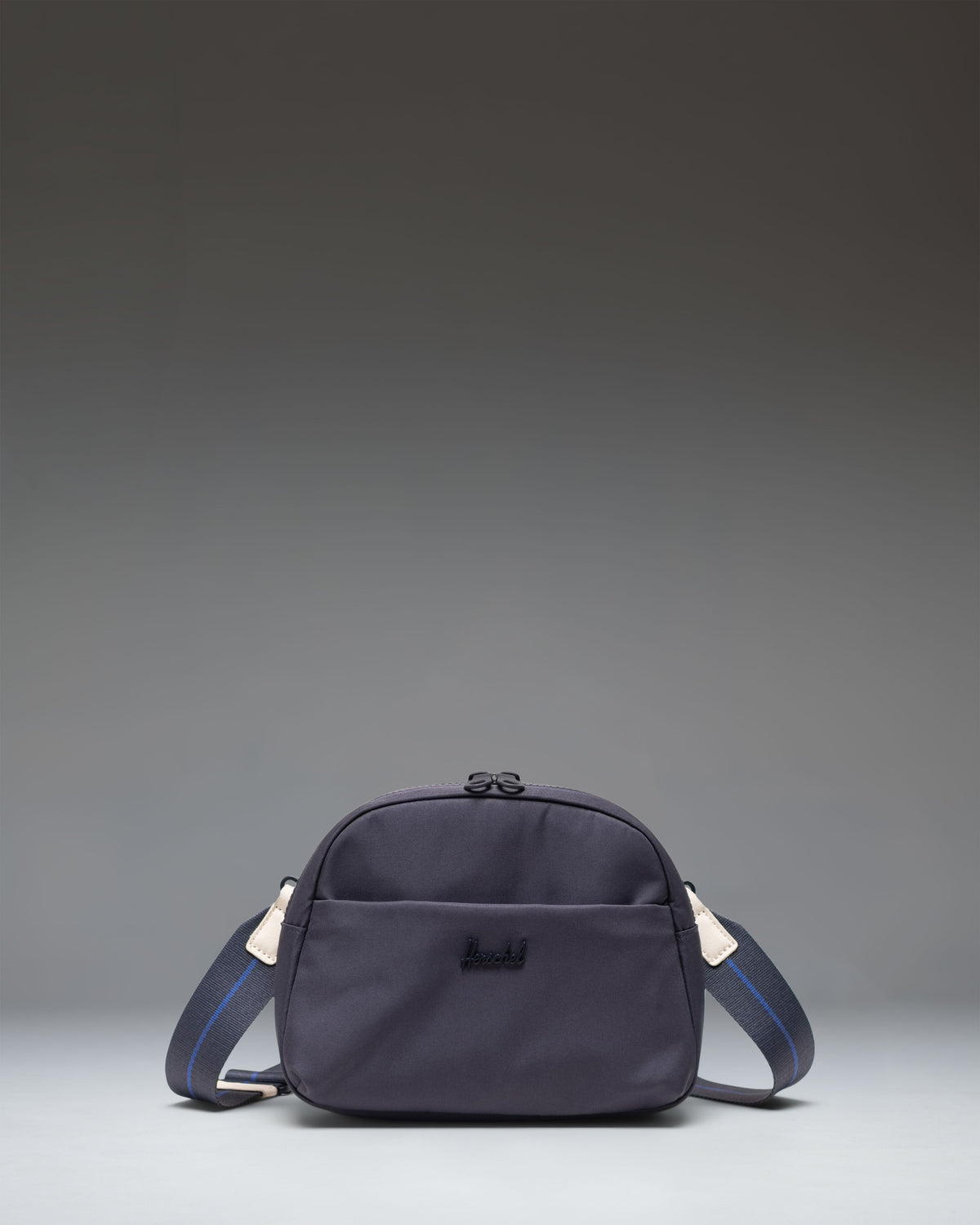 Herschel Supply Co. Thalia Crossbody bag featuring a zippered main compartment and a front zippered pocket.
