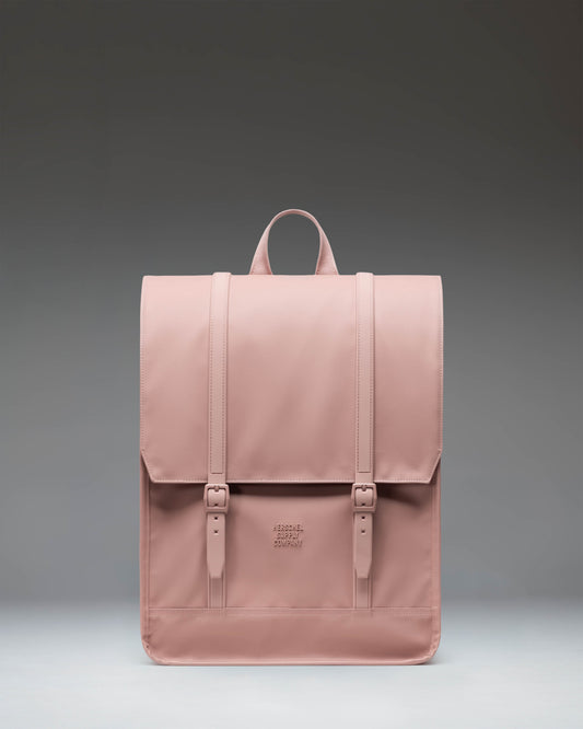 Herschel Survey Backpack in Ash Rose pink, featuring a classic dual-strap design with magnetic pin clips.