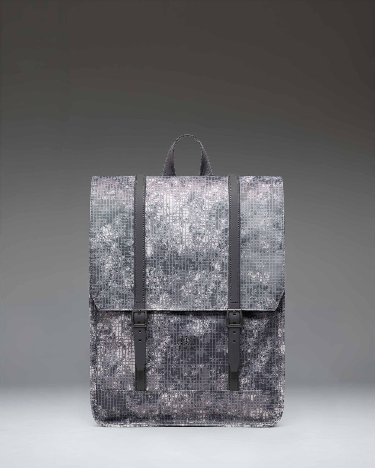 Herschel Survey Backpack in Cloud Grid colorway featuring a clean, minimalist design with dual strap closures.