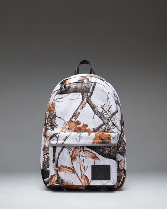 Herschel Classic XL Backpack in Realtree Edge Camo White/Black, featuring a front view of the camouflage-patterned backpack.