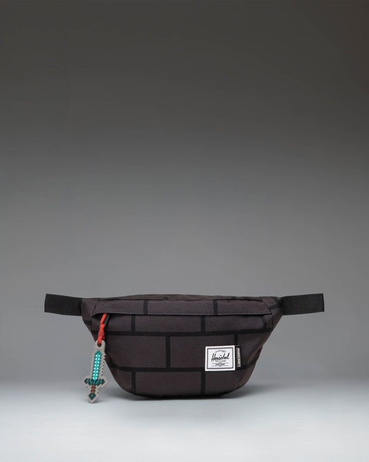 Minecraft Herschel Classic Hip Pack in The Nether colorway, featuring a pixelated dark red and orange design with an adjustable waist strap.