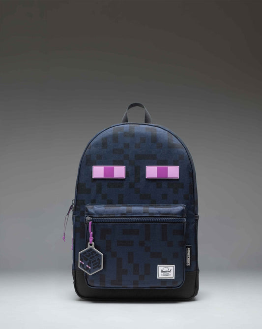 Herschel Supply Co. Minecraft Heritage Youth Backpack in Enderman black and purple with pixelated eye graphics.