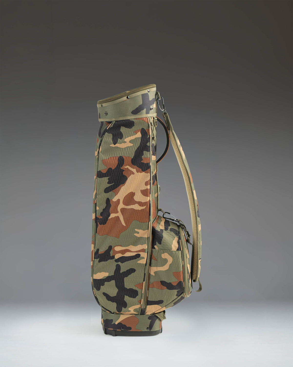 Herschel Watt Sunday Bag in Woodland Camo, a lightweight golf bag with a carrying strap and a stand.