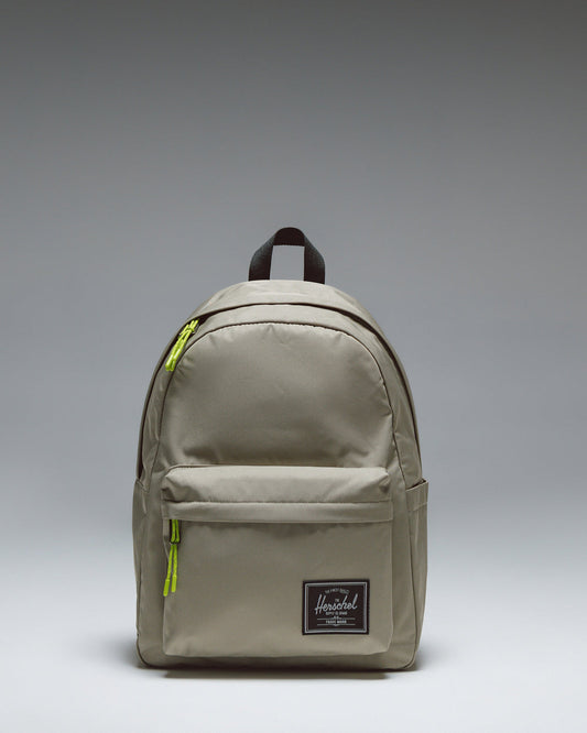 Herschel Classic Backpack Twill in Laurel Oak, showing the clean front design with a zippered pocket and woven label.