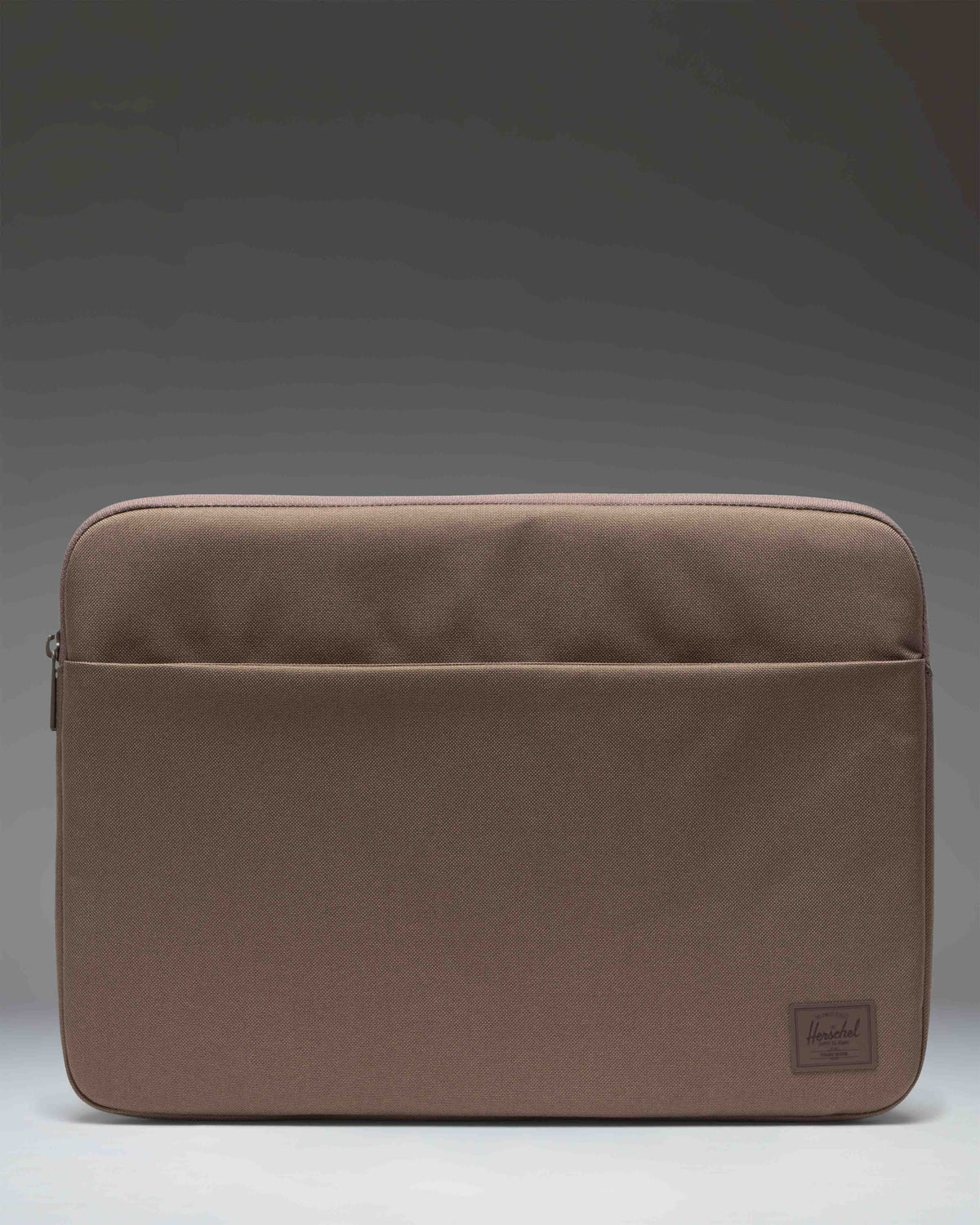 Herschel Supply Co. Denman 15-16 Inch Sleeve Tech laptop case in light brown.