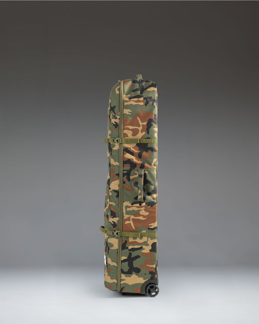 Herschel Heritage Golf Travel Wheelie Bag in Woodland Camo print, featuring wheels and a durable exterior design for protecting golf clubs.