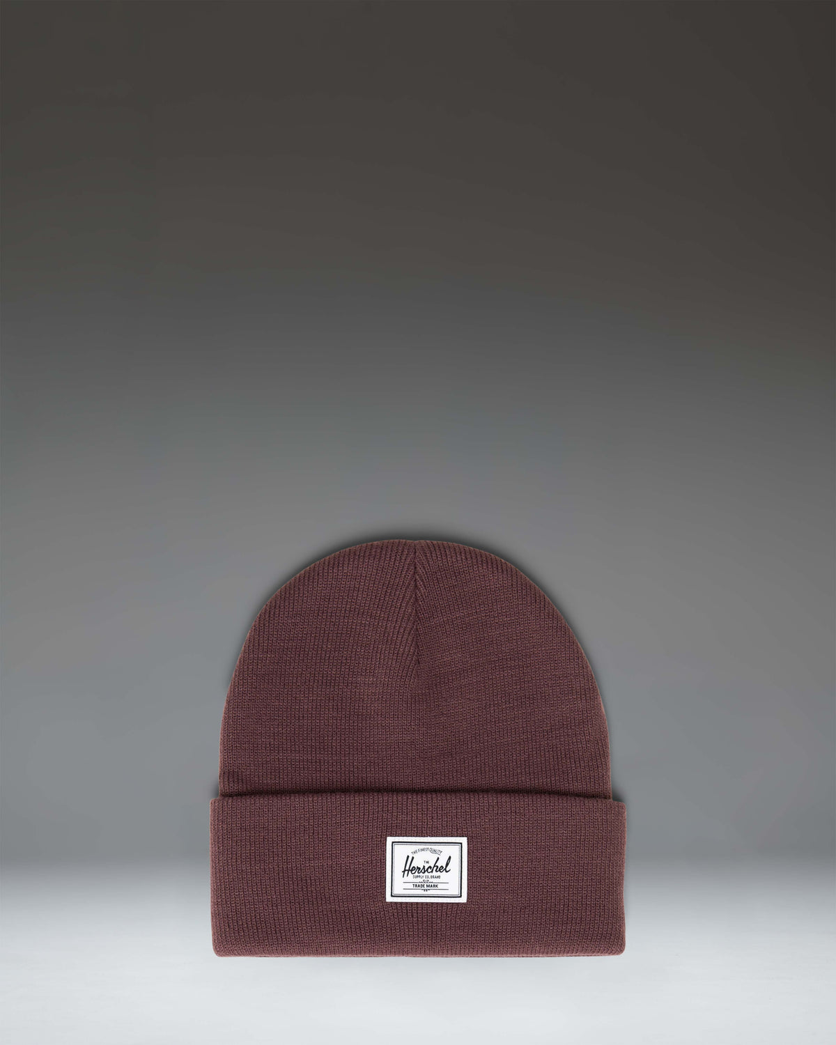 Herschel Supply Co. Elmer Beanie in Huckleberry, a classic knit cuff beanie in a deep purple colorway with a woven classic logo label on the cuff.