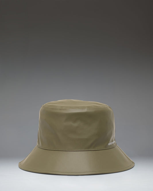 Herschel Supply Co. Norman Rain Bucket Hat in Ivy Green, showcasing a flat lay view of the waterproof fabric and wide brim.