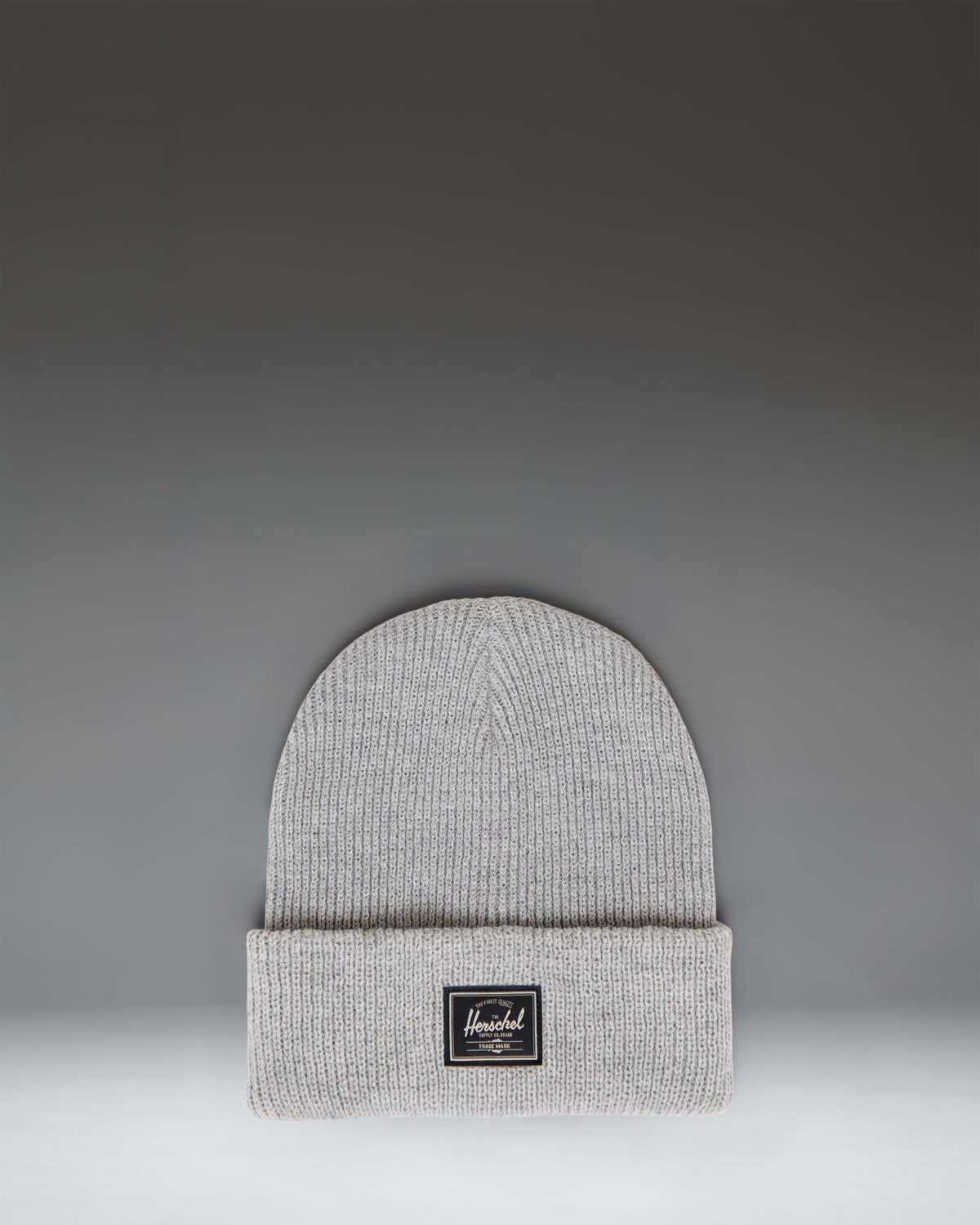 Herschel Supply Co. Elmer Reflective Ribbed Beanie in Heather Light Grey Reflective, featuring a classic cuffed design and woven logo label.