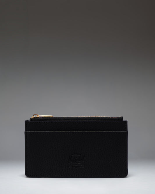Herschel Supply Co. Oscar Large Cardholder in black vegan leather, shown from a front perspective detailing the card slots and sleek design.