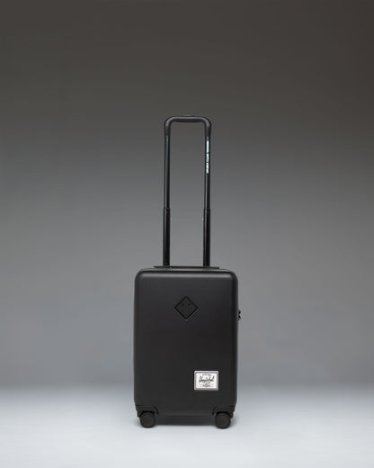 Herschel Supply Co. Heritage Hardshell Carry On Luggage in black.