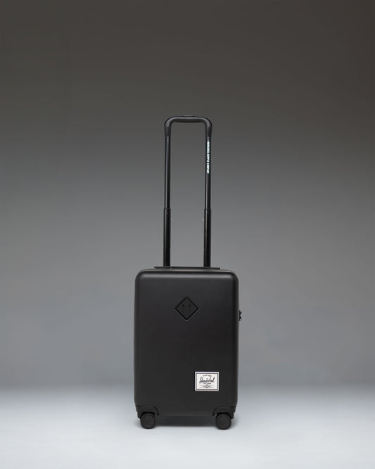 Herschel Supply Co. Heritage Hardshell Carry On Luggage in black.