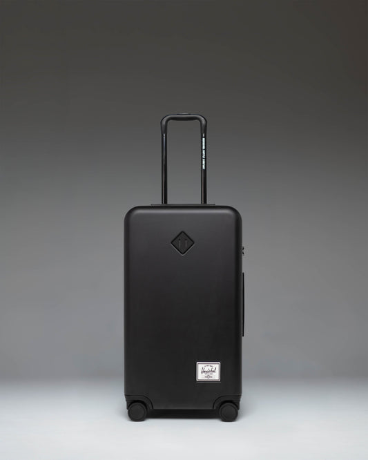 Black Herschel Heritage Hardshell Medium Luggage in black, front view.