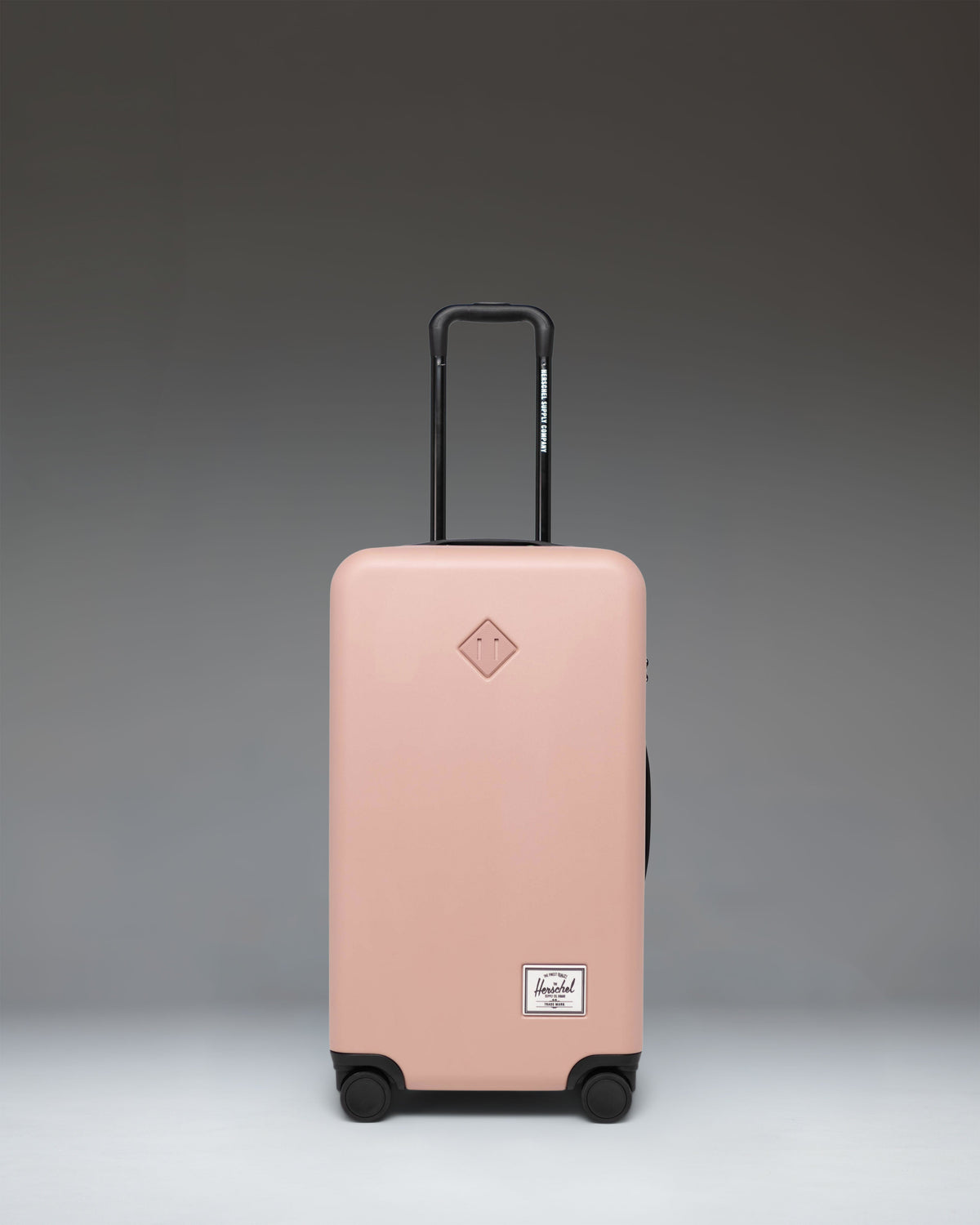 Herschel Heritage Hardshell Medium Luggage in Ash Rose.