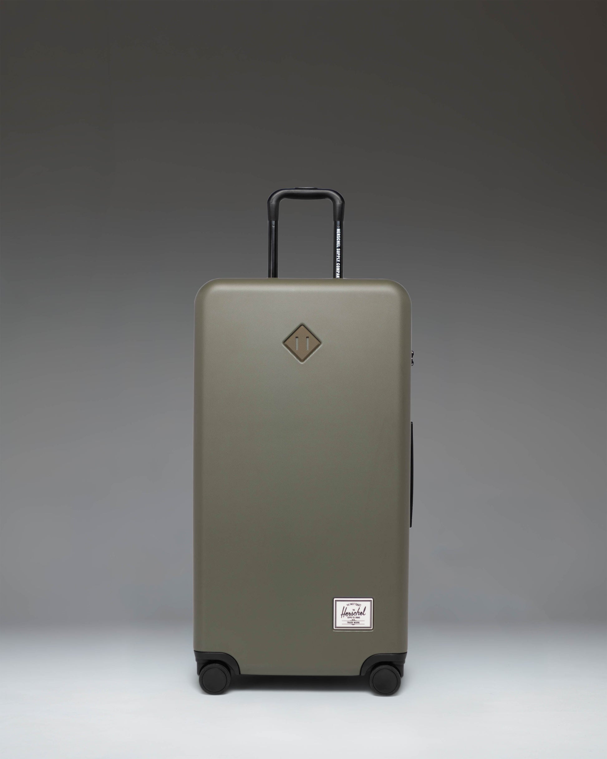 Herschel Heritage Hardshell Large Luggage in Ivy Green.