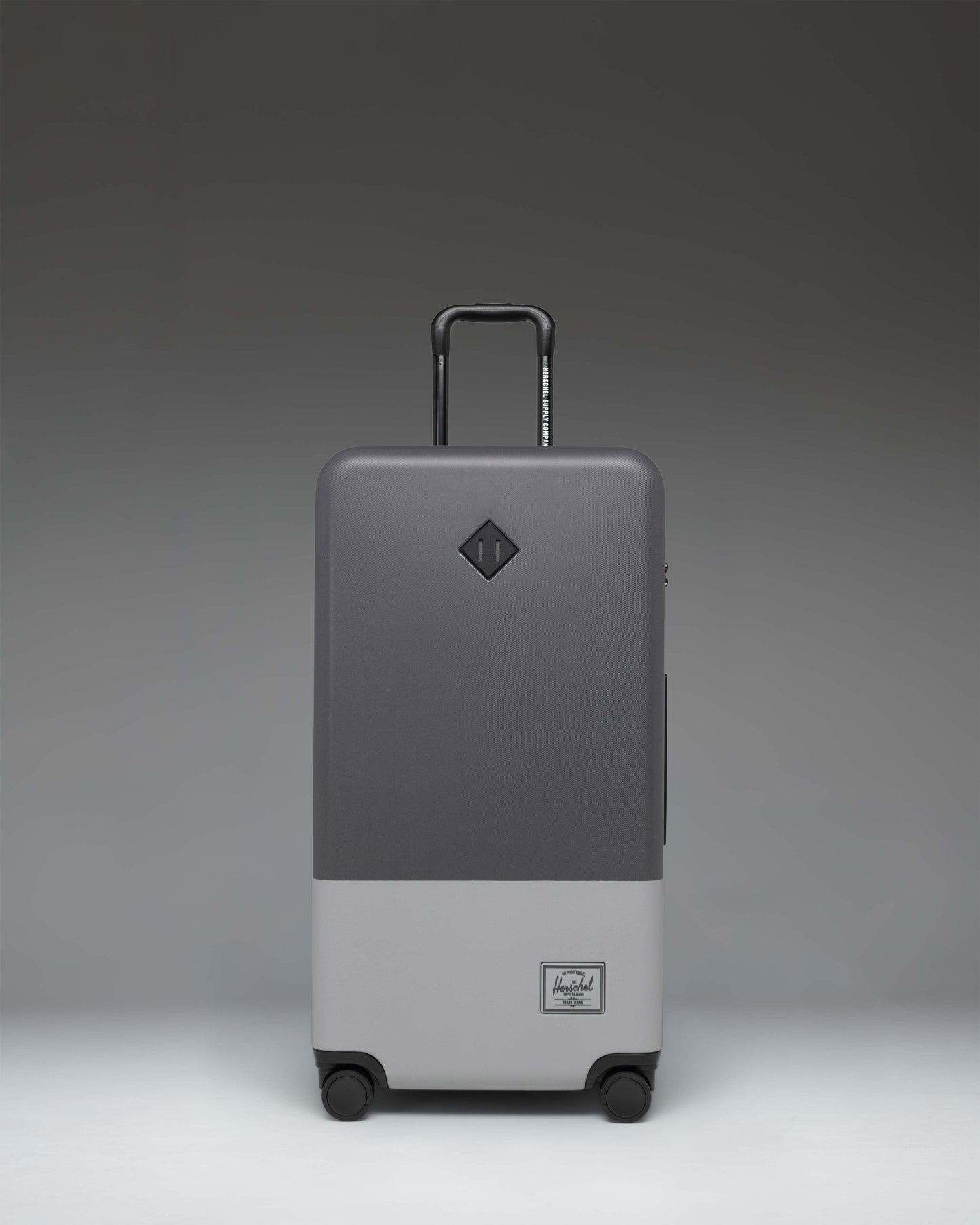 Herschel Heritage Hardshell Large Luggage in Blocked Gray.