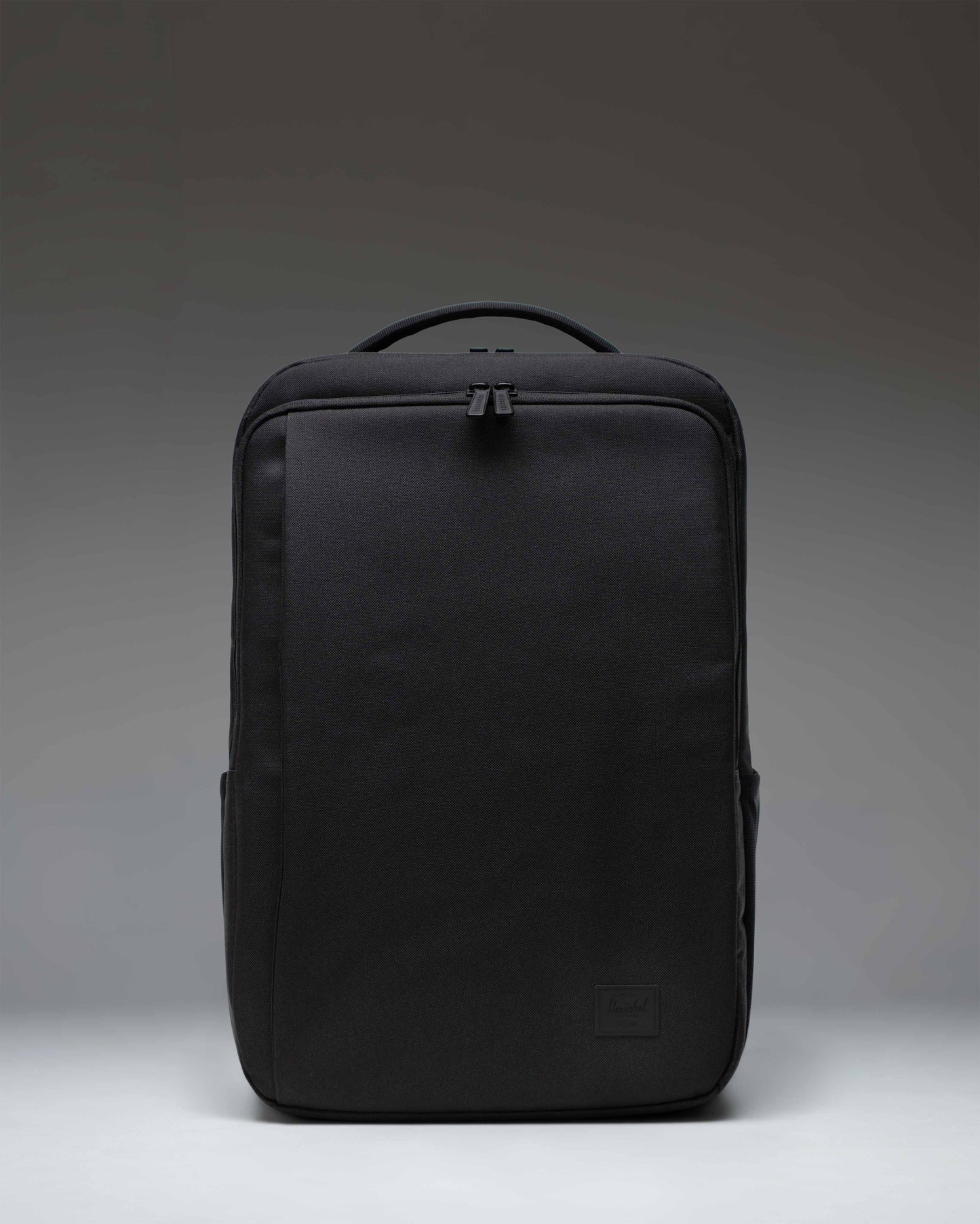 Herschel Supply Co. Kaslo Backpack Tech in black, showing the front view with zippered compartments and shoulder straps.