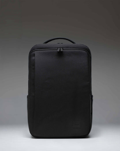 Herschel Supply Co. Kaslo Backpack Tech in black, showing the front view with zippered compartments and shoulder straps.
