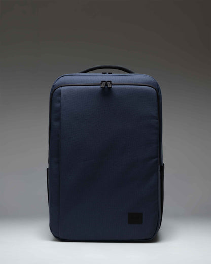 Herschel Supply Co. Kaslo Backpack Tech in Mood Indigo, showing the front view with zipper compartments and adjustable shoulder straps.