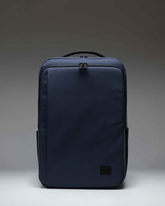 Herschel Supply Co. Kaslo Backpack Tech in Mood Indigo, showing the front view with zipper compartments and adjustable shoulder straps.