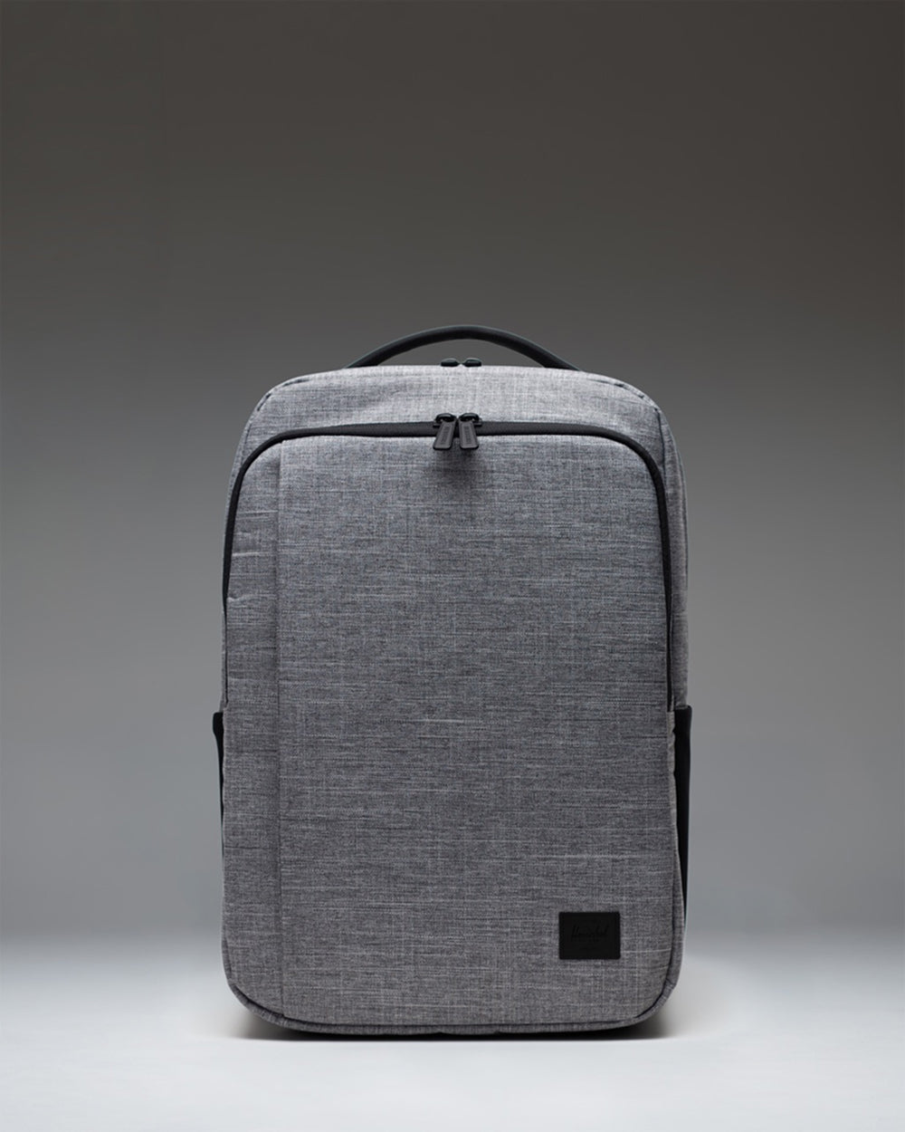 Front view of the Herschel Supply Co. Kaslo Daypack Tech in Raven Crosshatch, a grey textured backpack.