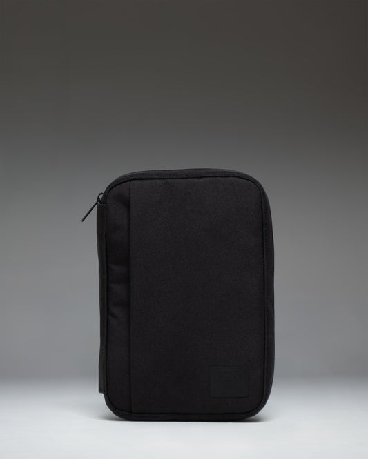 Black Herschel Supply Co. Burrard Organizer Tech pouch, front view showing the clean exterior design and classic woven label.