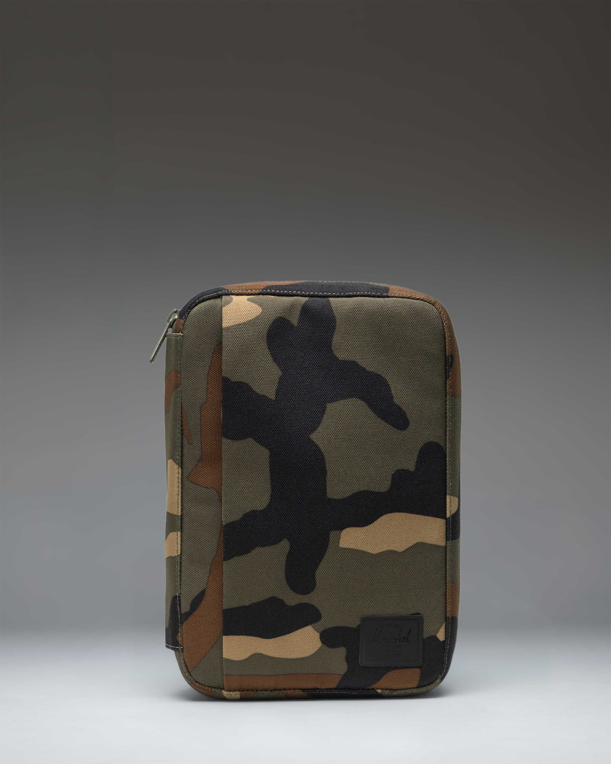 Herschel Burrard Organizer Tech in woodland camo pattern, showing the open layout with slots and compartments for tech accessories.