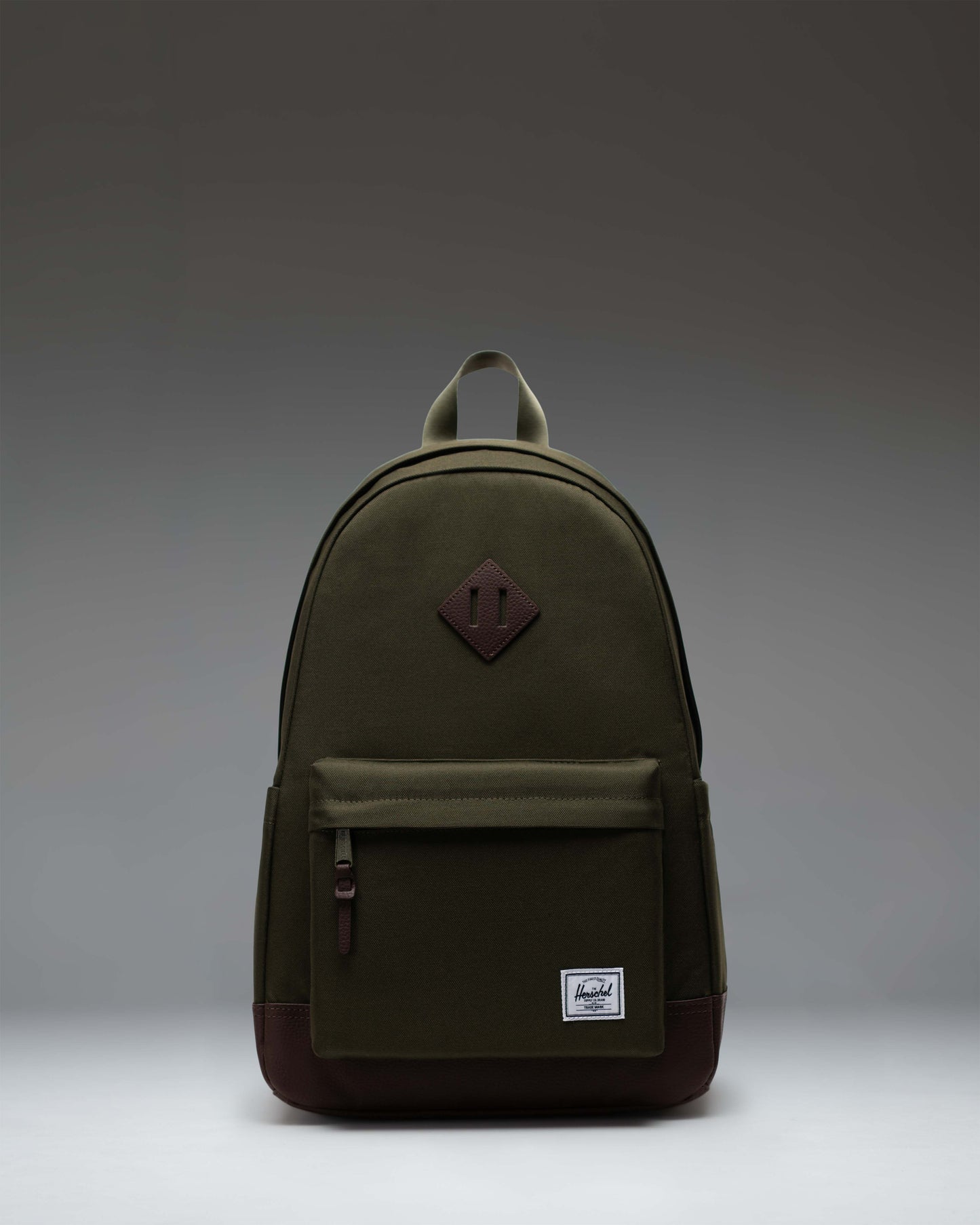 Herschel Heritage Backpack in Ivy Green/Chicory Coffee, showcasing the classic design and front pocket.