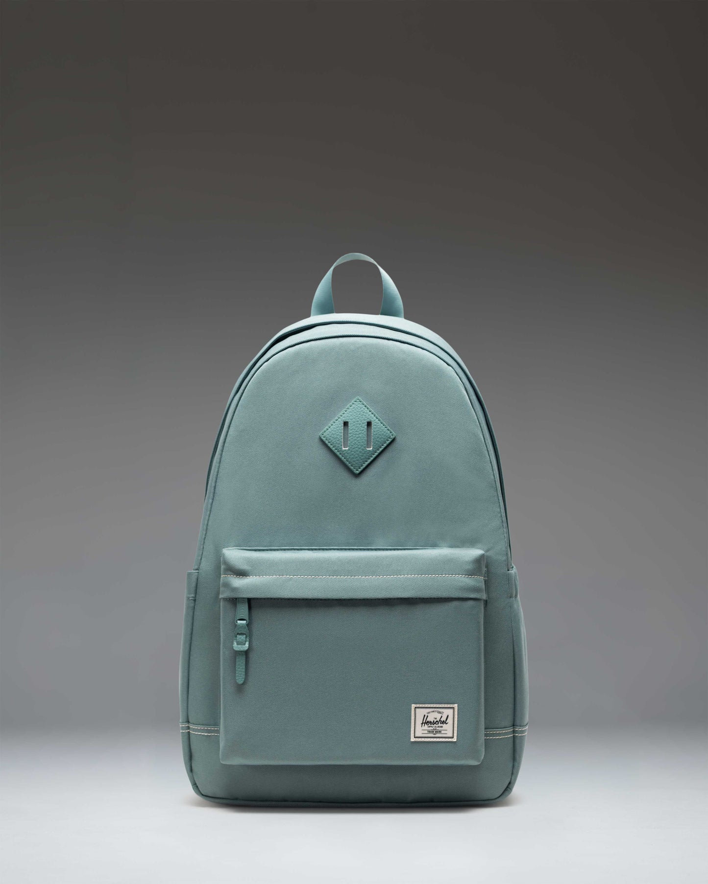 Herschel Heritage Backpack in a classic design featuring a front zippered pocket and the signature diamond detail accent.