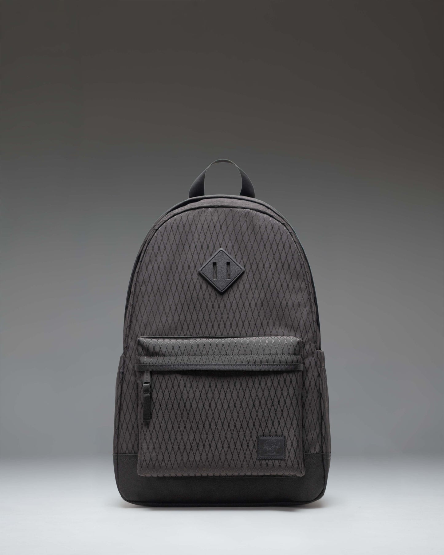Herschel Heritage Backpack in Black Diamond/Black showing the clean, classic front design with a single front pocket and diamond accent.