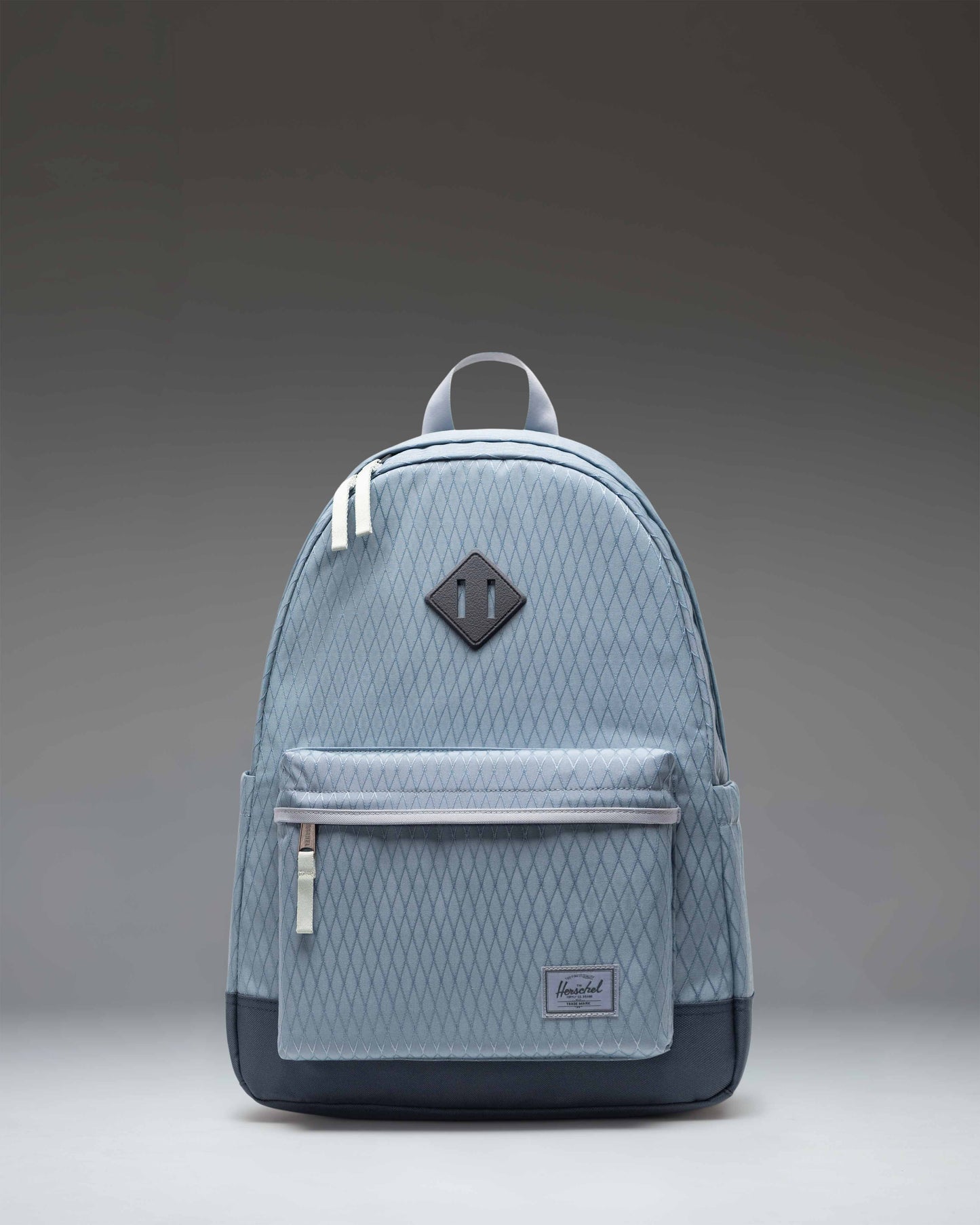 Herschel Heritage Backpack in Blue Mirage Diamond/Sea Storm, showing the classic design with a front pocket and diamond accent.