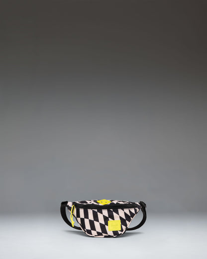 Herschel Heritage Hip Pack Little Herschel in Warp Check, a black and white checkered kids fanny pack with a brown rubber diamond accent.