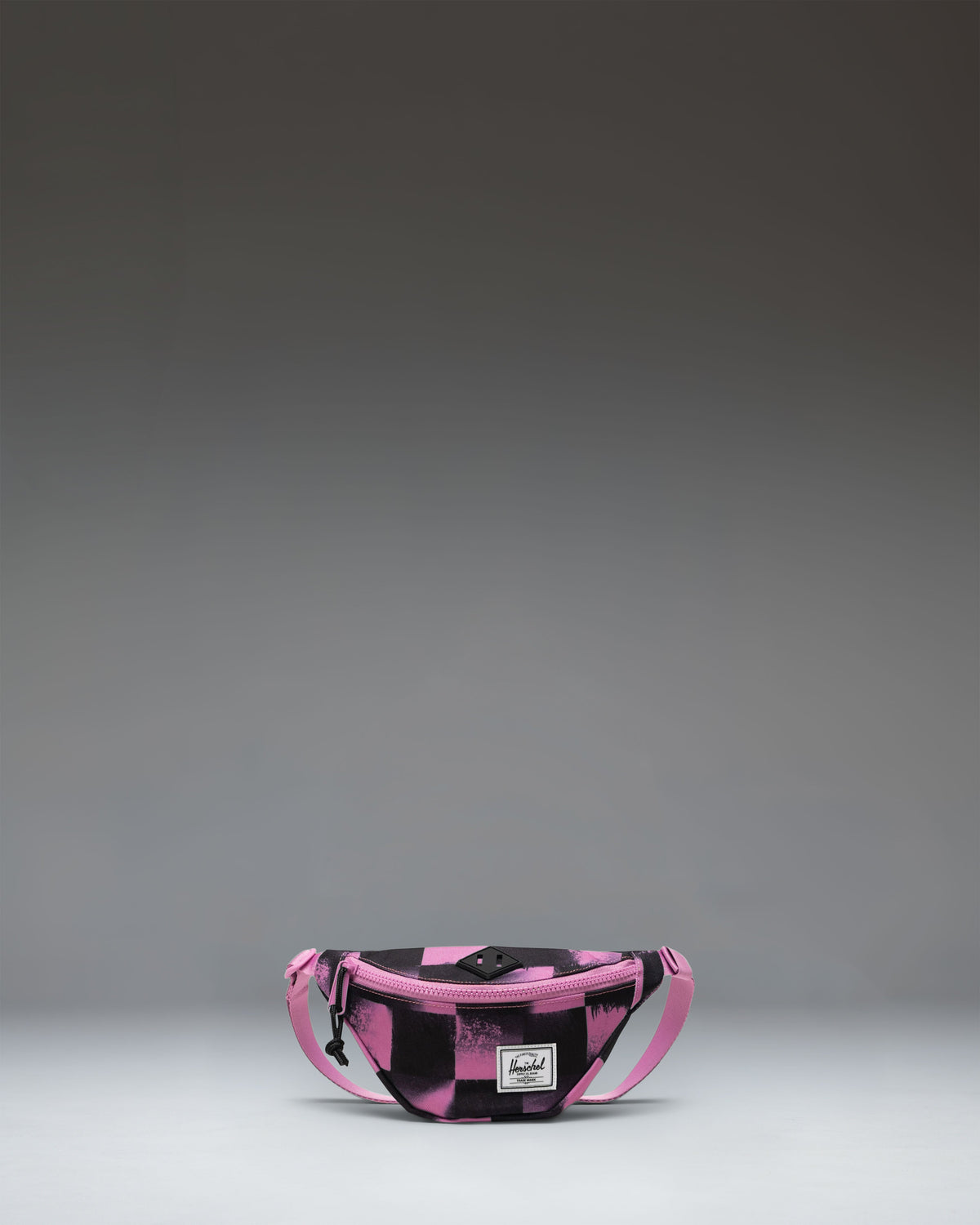 Herschel Heritage Hip Pack Little Herschel in Stencil Checker Opera Mauve, a kids pink and white checkered fanny pack.