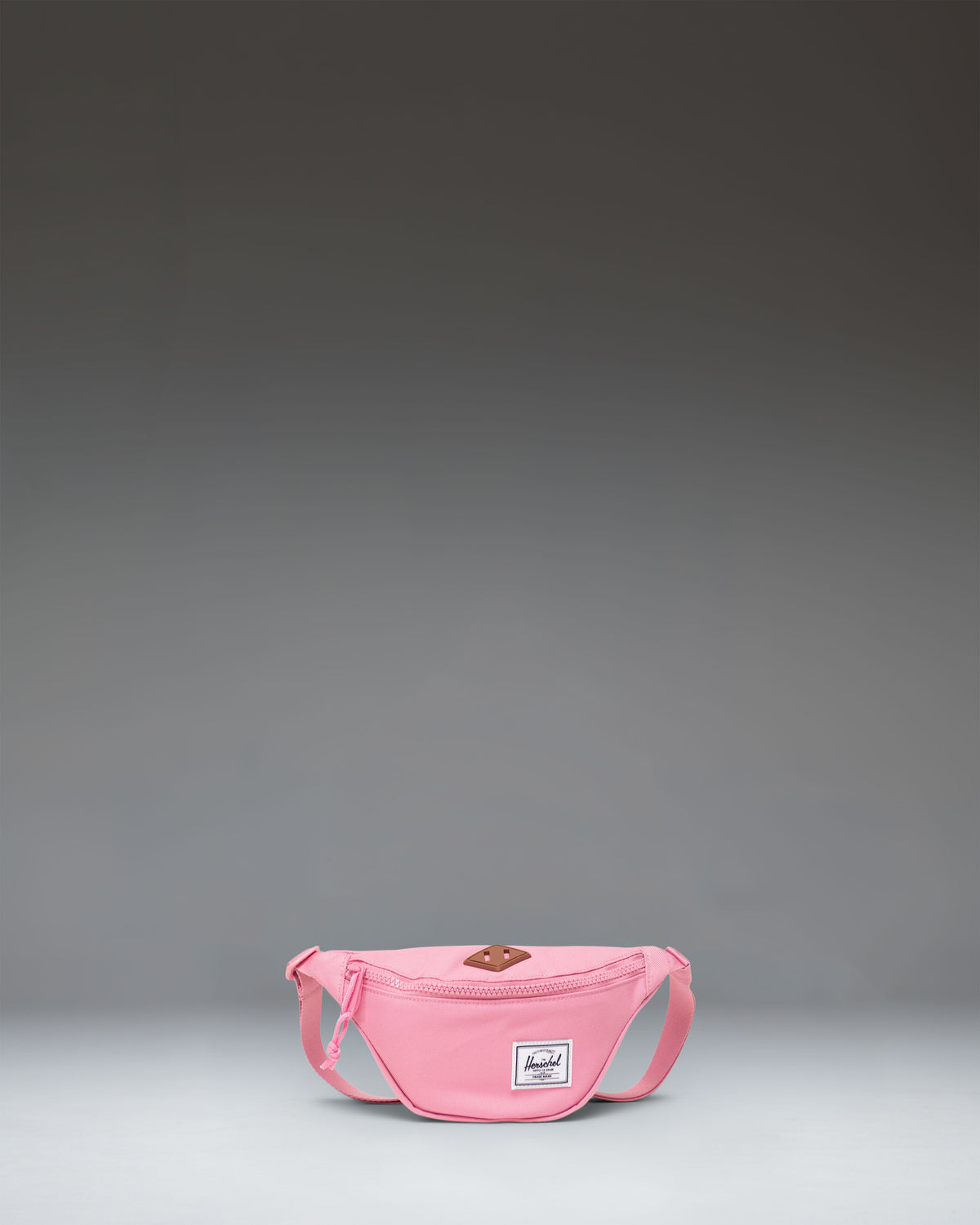 Herschel Heritage Hip Pack Little Herschel in Cashmere Rose pink, featuring a front zippered pocket and adjustable strap.