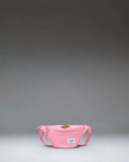 Herschel Heritage Hip Pack Little Herschel in Cashmere Rose pink, featuring a front zippered pocket and adjustable strap.