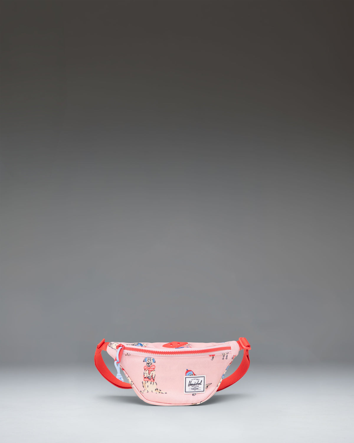 Herschel Heritage Hip Pack Little Herschel in Fashion Dogs print, featuring a light blue background with various illustrated dogs.