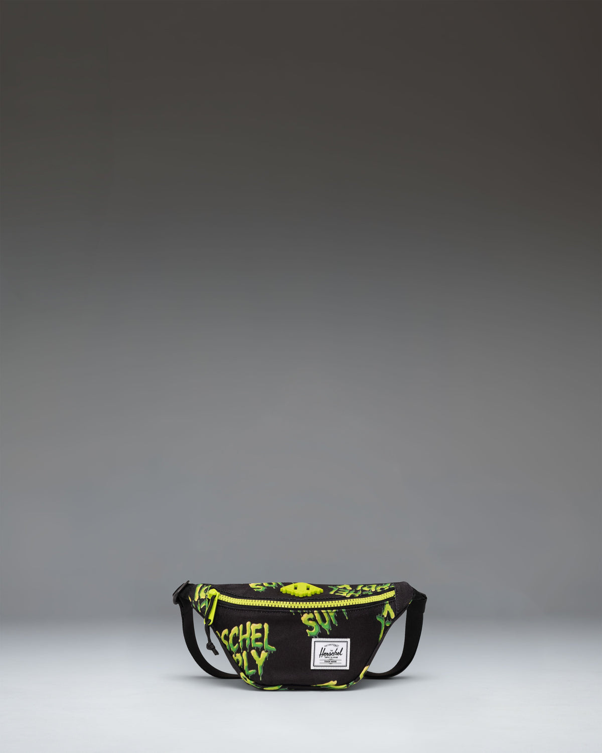 Herschel Heritage Hip Pack Little Herschel in bright HSC Slime green, featuring a front zippered pocket and adjustable strap.