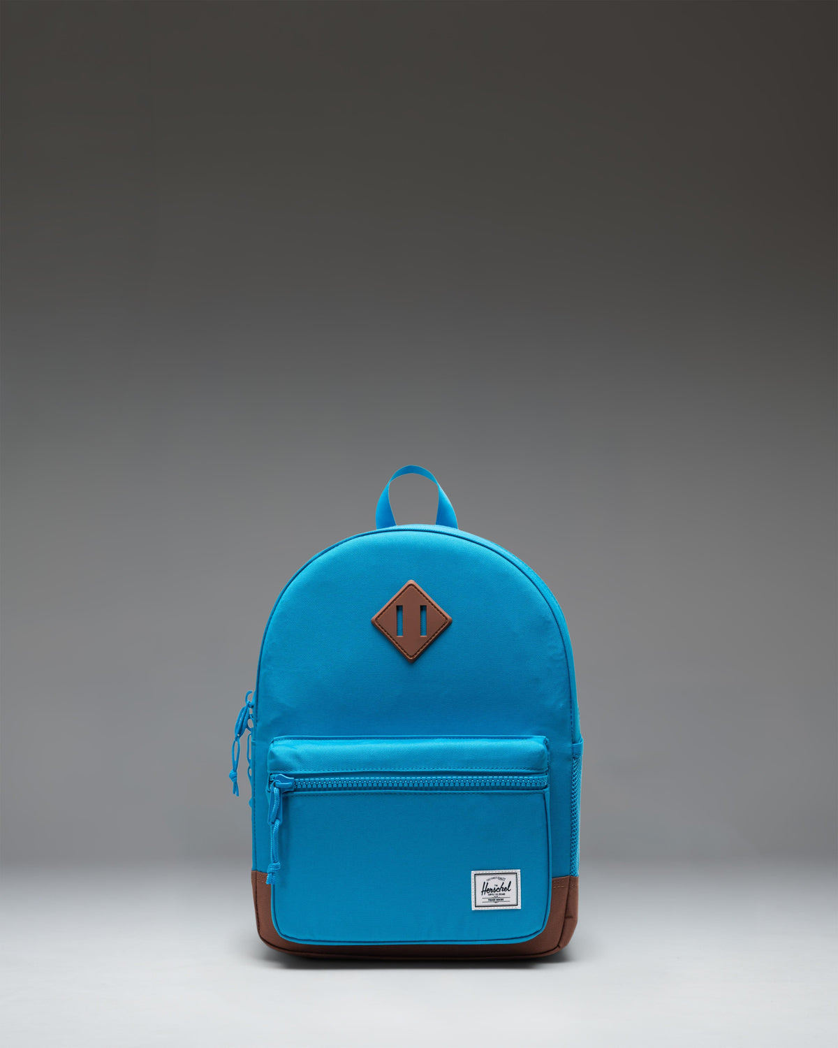 Herschel Heritage Kids Backpack in Hawaiian Surf blue with a Saddle Brown diamond accent and base.