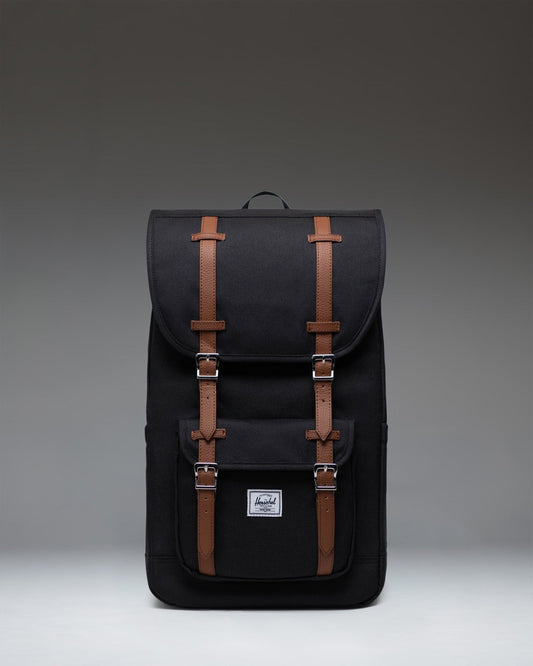 Herschel Supply Co. Little America Backpack in black, featuring a classic mountaineering style with dual rubber straps and a front pocket.