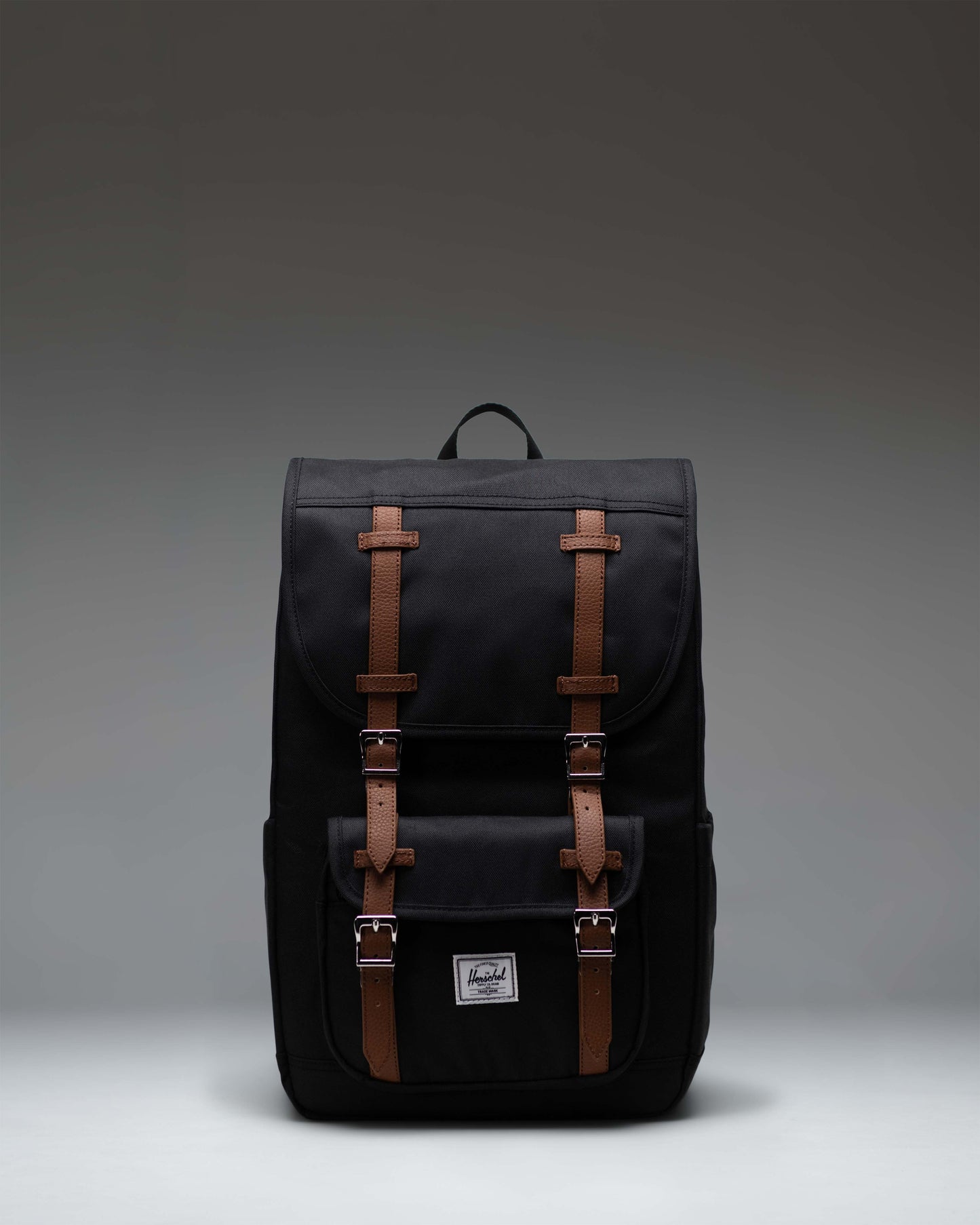 Herschel Supply Co. Little America Mid Backpack in black, showcasing its classic design with double rubber straps and front pocket.
