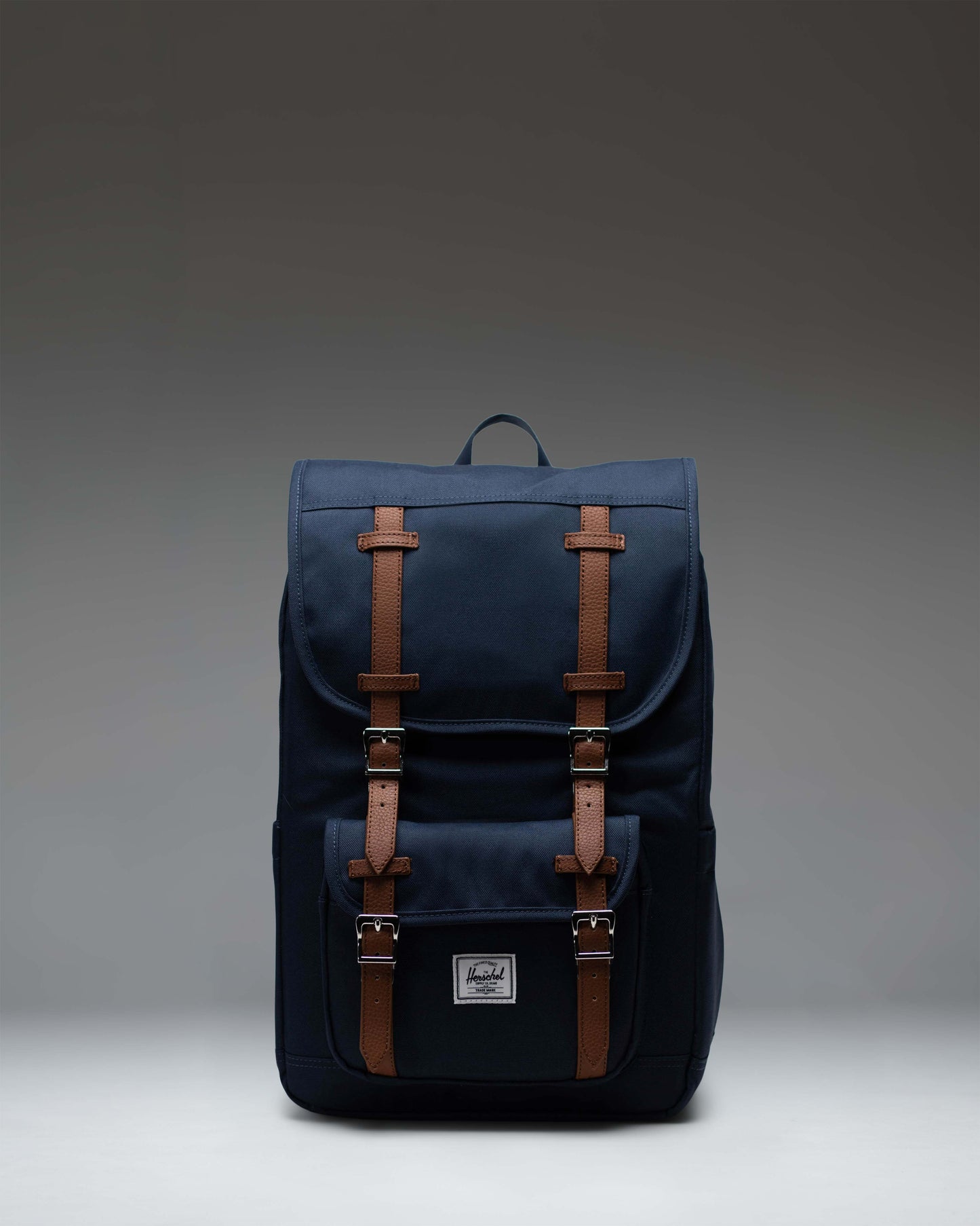 Herschel Little America Mid Backpack in Navy, lifestyle view on a model.