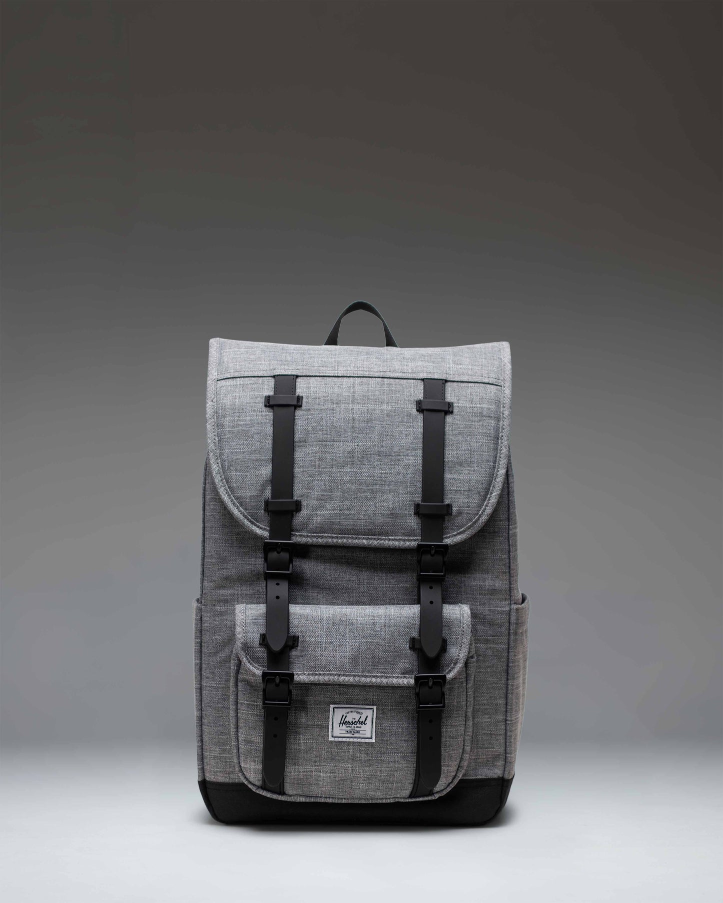Herschel Little America Mid Backpack in Raven Crosshatch grey with black rubber straps and a classic woven label.