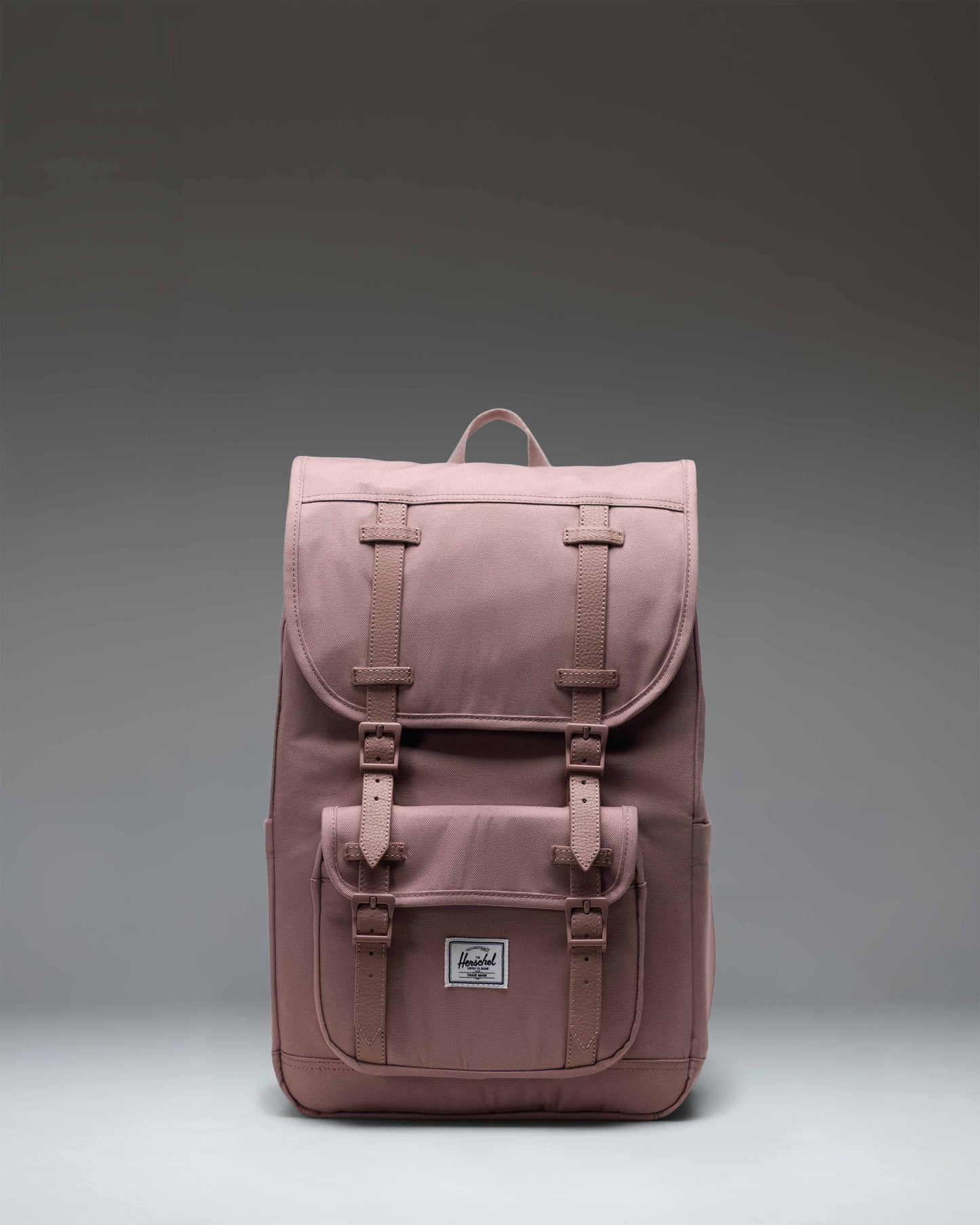 Herschel Supply Co. Herschel Little America Mid Backpack in Ash Rose pink, featuring rubber straps and a front pocket.