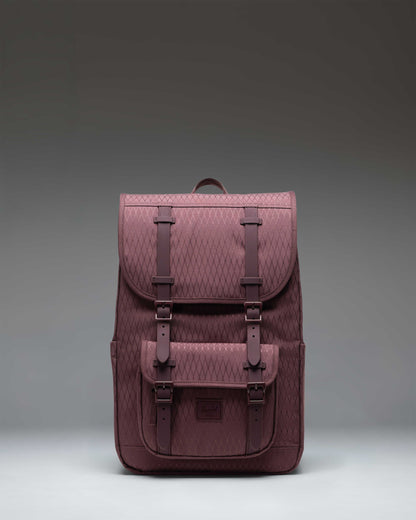 Herschel Little America Mid Backpack in Huckleberry Diamond, featuring a purple geometric pattern, front pocket, and black rubber straps.