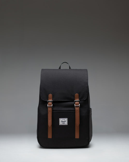 Herschel Retreat Small Backpack in black, showcasing its classic design with a single strap closure and a clean, compact silhouette.