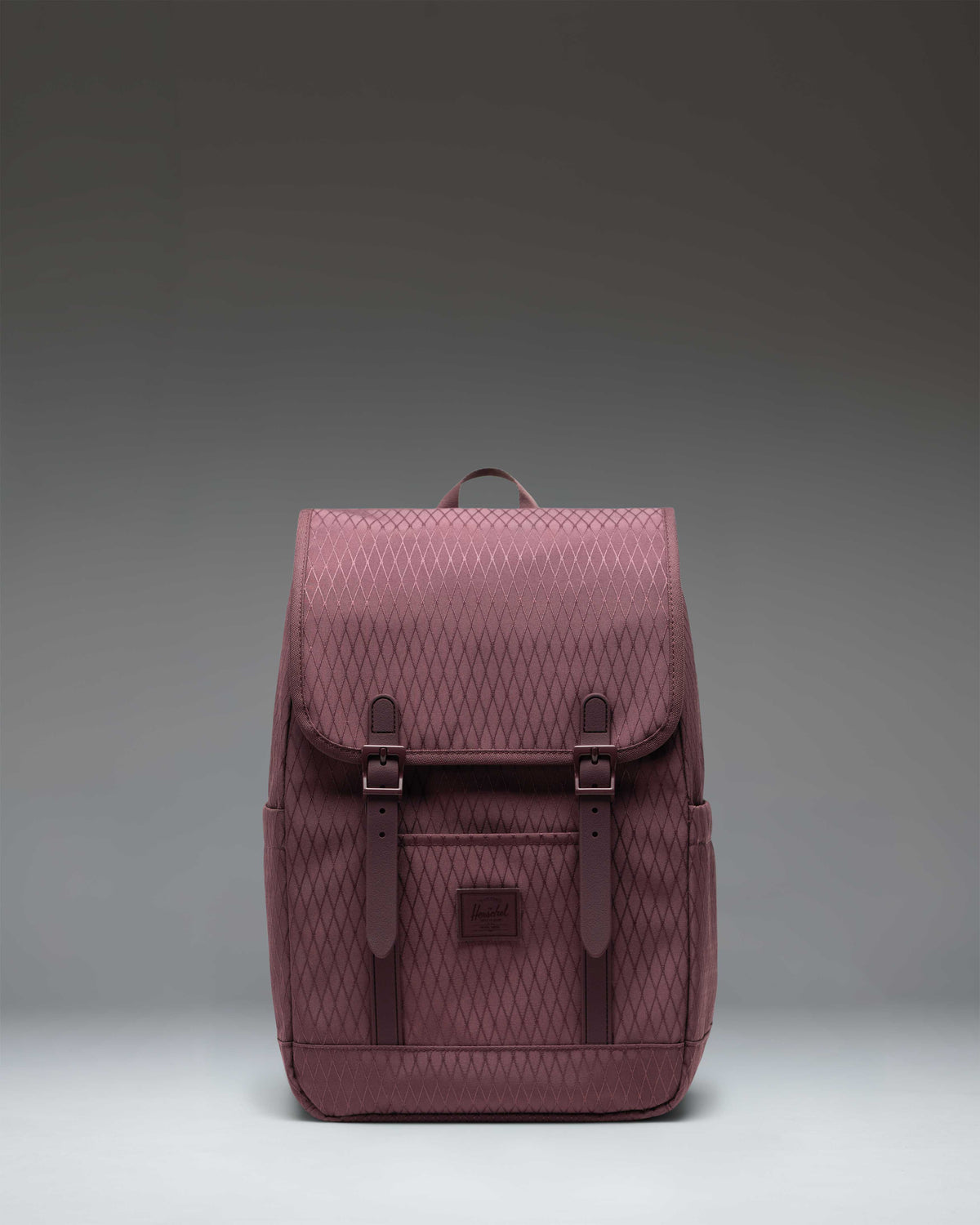 Herschel Retreat Small Backpack in Huckleberry Diamond featuring a classic cinch top design and dual magnetic strap closures.
