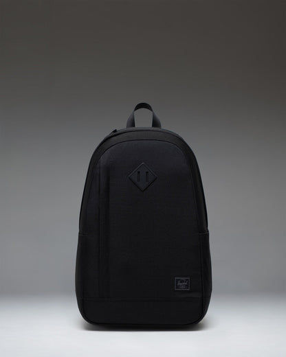 Herschel Seymour Backpack in Black Tonal, featuring a clean front view with zippered compartments and a tonal classic woven label.