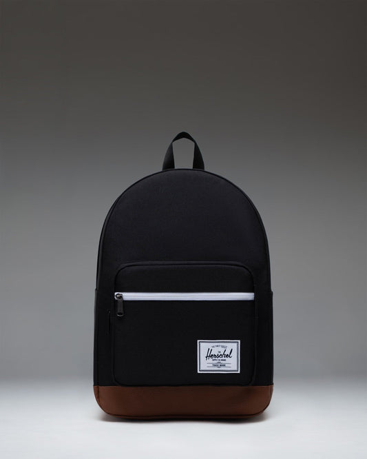 Herschel Supply Co. Pop Quiz Backpack in Black/Tan featuring a front pocket, leather accent, and signature woven label.